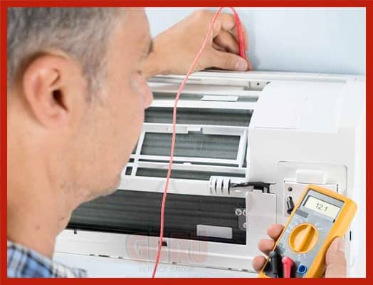 Technician performing Air Conditioner Maintenance