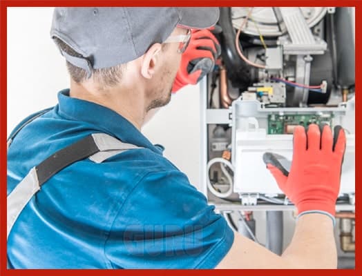 Heating technician inspecting HVAC system components